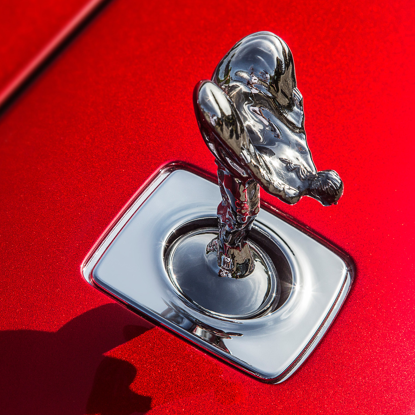 Rolls Royce Hood Ornament on red background