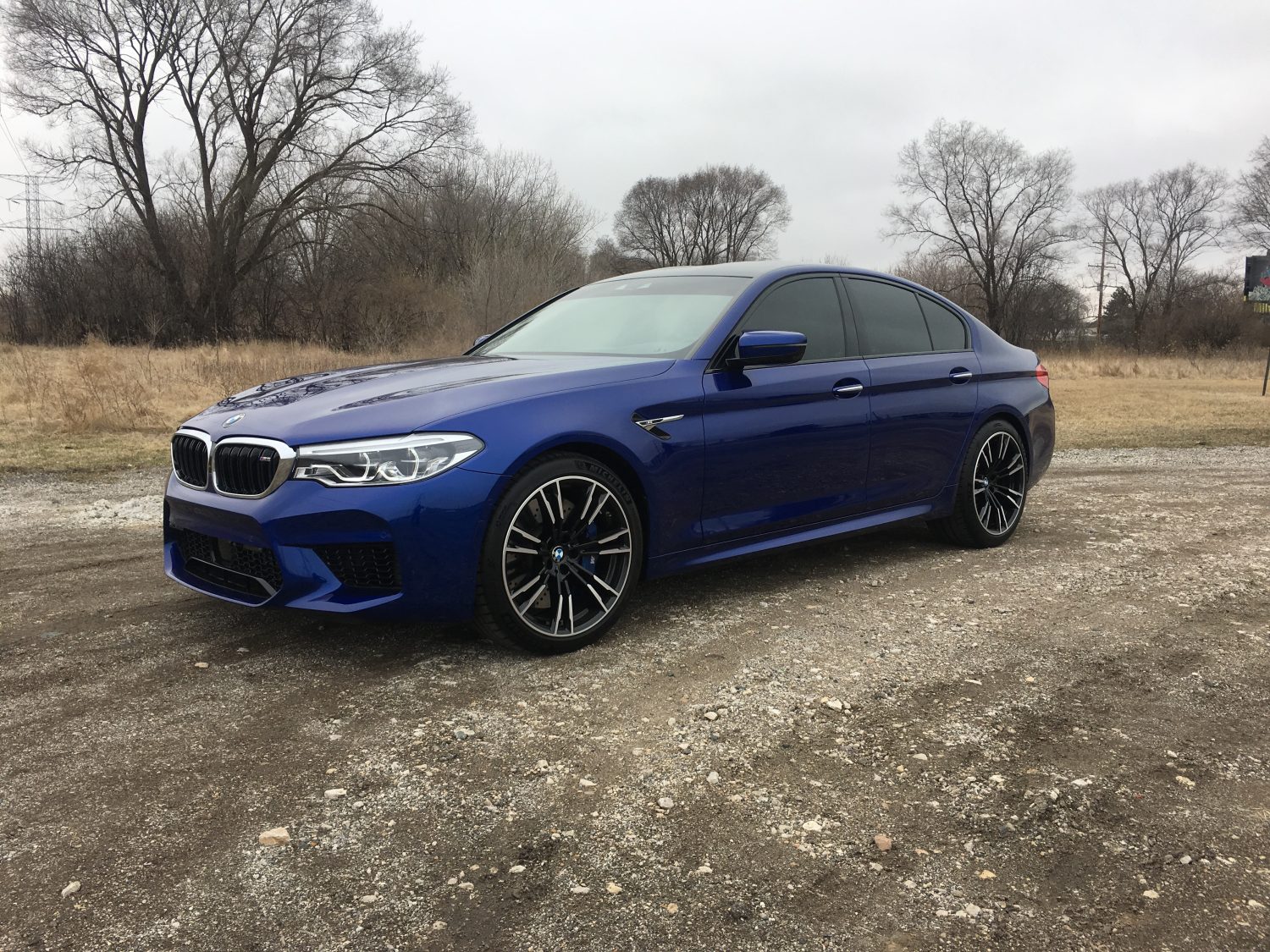 2018 BMW m5 on a dirt road