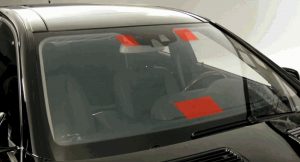 Radar detector positioning locations on UV coated and heated windshields