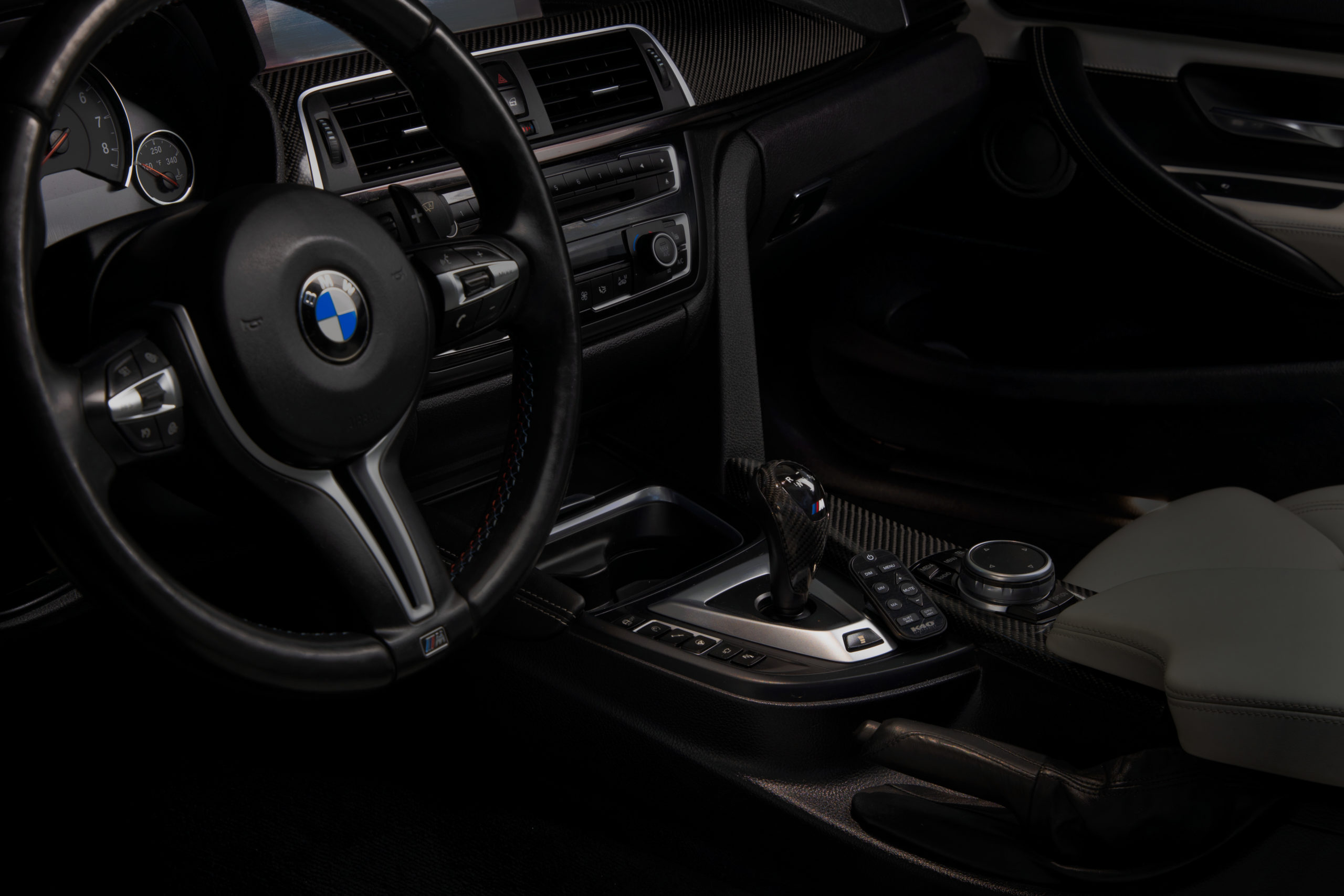 K40 Platinum360 remote installed next to gear shift in BMW SUV